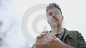 Close-up of a Magician's Hands Performing Card Trick. Throwing and Catching Cards in the Air. Background is Black