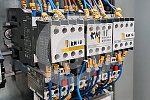 Close-up of magnet starters in electrical cabinet of automation control industrial system