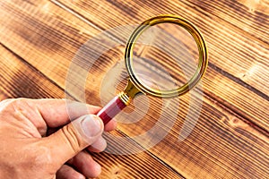 Close-up of a magnifier in hand