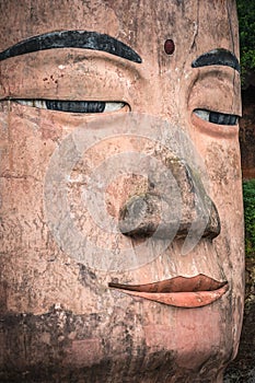 Close up of majestic Giant Leshan Buddha head and face