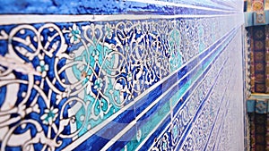 Close-up of majolica panels on the walls traditionally blue-white-blue coloured
