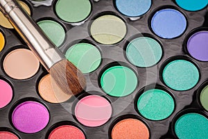 Close-up of make-up eye shadow palette with brush