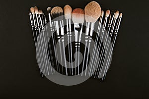 close up of a make up powder and a brush