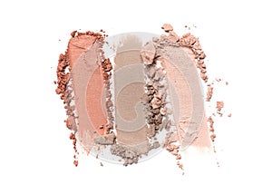 Close-up of make-up swatch. Smear of crushed beige and brown eye shadow foundation