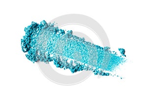 Close-up of make-up swatch. Smear of crushed shiny blue eye shadow