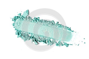 Close-up of make-up swatch. Smear of crushed turquoise eye shadow