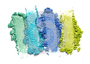 Close-up of make-up swatches. Smears of crushed shiny color eye shadow