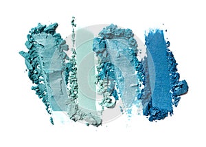 Close-up of make-up swatches. Smears of crushed turquoise eye shadow