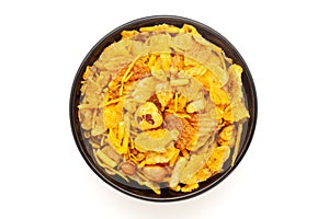 Close-up of Makhana Mix Indian namkeen (snacks) on a ceramic black bowl.