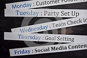 Close up making agenda weekly schedule on personal organizer. Business and entrepreneur concept. Isolated on blackboard