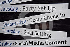 Close up making agenda weekly schedule on personal organizer. Business and entrepreneur concept. Isolated on blackboard