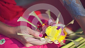 Close up making offerings in Bali