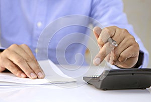 Close up of male accountant or banker making calculations