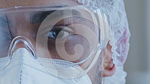 Close up male black tired and sleepy eye half face man doctor wearing personal protective glasses medical special