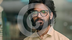 Close up male business portrait headshot serious bearded Arabian Hispanic Indian man corporate agent company worker