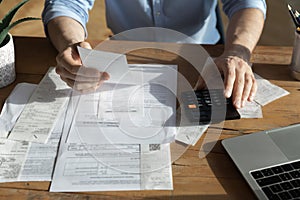 Close up of male busy managing financial paperwork