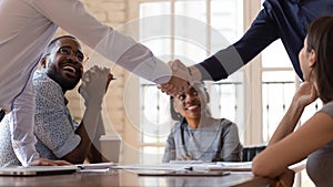 Close up of male colleagues handshake closing deal