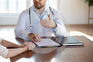 Close up of male doctor consult patient