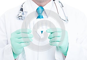 Close-up of male doctor holding blister of suppositories