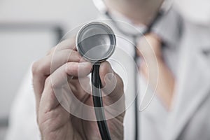 Close up of male doctor holding a stethoscope