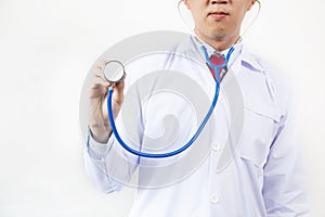 Close-up of male doctor using stethoscope and focusing on stethoscope