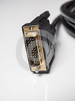 Close-up of male DVI cable connector on white background. Cable for connecting multimedia devices