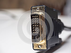 Close-up of male DVI cable connector on white background. Cable for connecting multimedia devices
