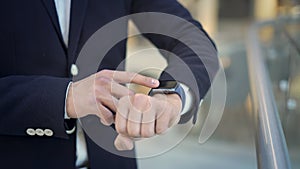 Close up of male finger swiping to the left on smartwatch