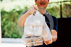 Close-up of male food delivery man on job