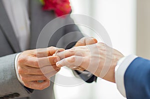 Close up of male gay couple hands and wedding ring
