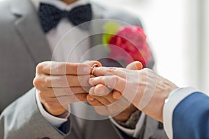 Close up of male gay couple hands and wedding ring