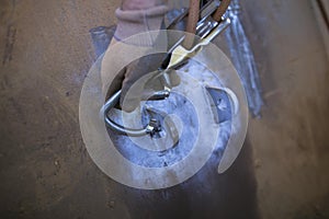 Close up male hand Clipping rope access Karabiner which connecting with descender and 10.5 MM low stretch rope into lifting indust photo