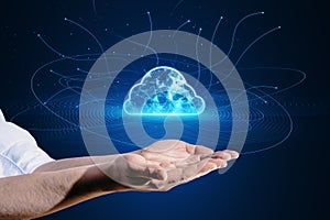 Close up of male hand holding digital polygonal cloud with lines on background. Cloud storage and computing concept