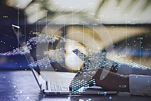 Close up of male hand using laptop and smartphone with abstract digital map and index lines on blurry outdoor background. Global