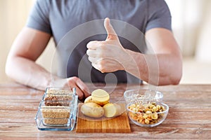 Close up of male hands with carbohydrate food