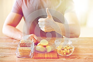 Close up of male hands with carbohydrate food