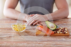 Close up of male hands with food rich in protein