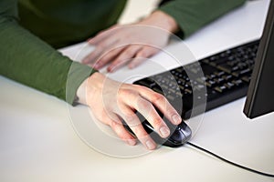 Close up of male hands holding computer mouse