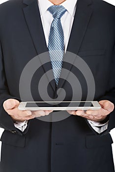 Close up on male hands holding digital tablet