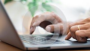 Close-up of male hands typing on keyboard Working On Compute Sitting Table And Office Tools At Workplace, writing emails,