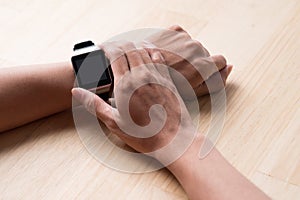 Close up of a male hands using a modern smart watch.