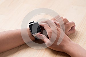 Close up of a male hands using a modern smart watch.