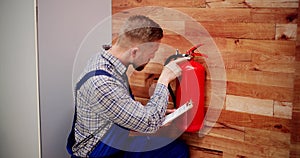 Close-up Of Male Professional Checking A Fire