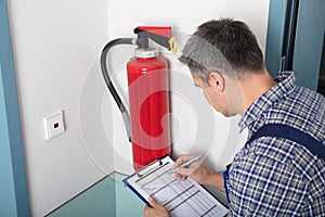 Professional Checking A Fire Extinguisher