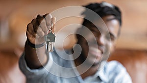 Close up of male renter show house keys