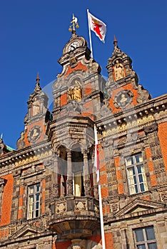 Close up of MalmÃ¶ RÃ¥dhus Radhus townhall with clock, statues, balcony flag in Malmo, Big Square Stortorget, Sweden