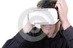 Close up man in 3d headset watching something fascinating and surprising while experiencing virtual reality vr glasses