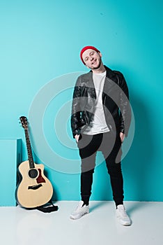 Close Up Of Man with Acoustic Guitar In Studio