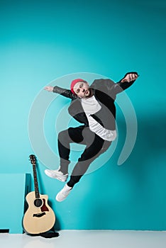 Close Up Of Man with Acoustic Guitar In Studio