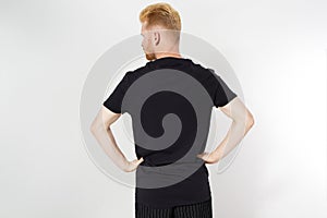 Close up of man in blank t-shirt, black t shirt on caucasian man closeup isolated